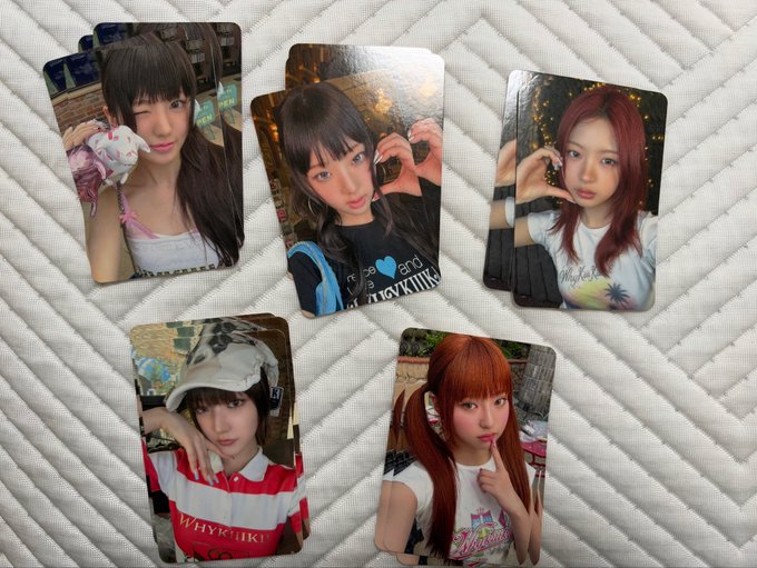 Five photo cards featuring a young woman with various hair colors and styles, including dark hair, red hair, and orange pigtails, posing in different settings.