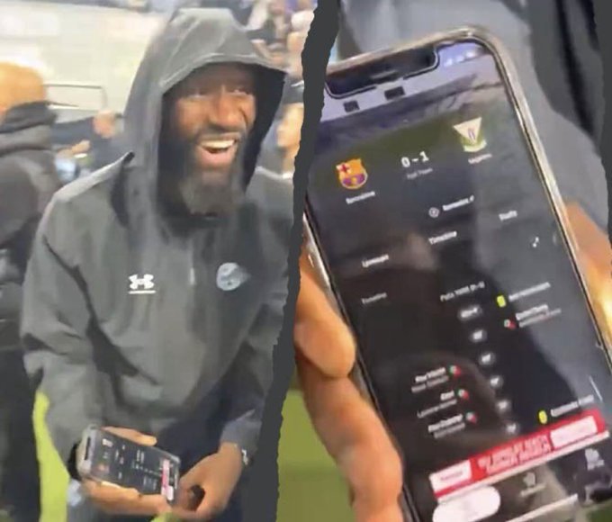 A split image shows a smiling man in a hooded jacket watching a soccer match, alongside a phone screen displaying a live sports app showing a 0-1 score between Barcelona and another team.