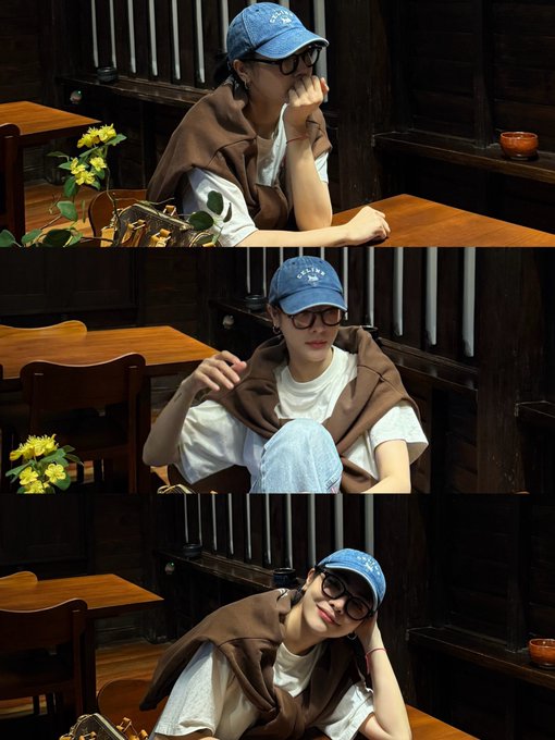 A three-panel collage of a woman wearing a blue denim cap, glasses, white t-shirt, and brown sweater draped over her shoulders, posing at wooden tables in a rustic interior with sunflowers.