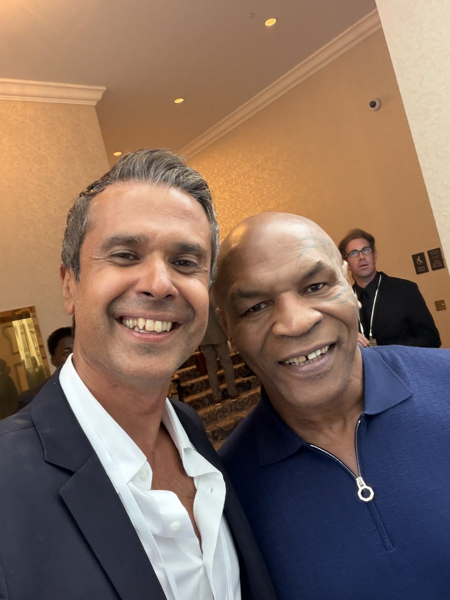 DrAseemMalhotra's tweet photo. An absolute delight to meet one of my childhood heroes, THE GOAT! Not just compassionate with a great sense of humour but fully immersed in enhancing his mental, physical and social wellbeing. Thank you Mike Tyson, you’re a great ambassador for #Maha https://t.co/NglZRJTI8X