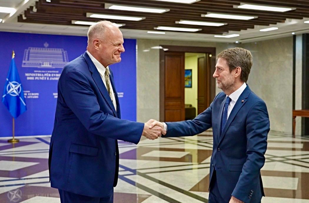 HoxhaFer's tweet photo. A distinct pleasure to welcome #Ambassador Eric Wendt to Albania and to the Ministry for Europe and Foreign Affairs for our first meeting.

The United States remains one of Albania’s closest and most valued strategic partners. Our relationship rests on shared democratic values, a strong security partnership within #NATO, and a longstanding friendship between our peoples. The American imprint on key and defining moments of #Albania’s history is indelible and remains a powerful foundation for our strong and ever-deepening strategic partnership.

For Albania, membership in the #European Union as the top national priority, and a strong, enduring transatlantic partnership are two sides of the same coin. We remain firmly committed to further strengthening our strategic partnership and transatlantic bonds in the years ahead.

I look forward to working together to further deepen our bilateral ties, including to expand economic and investment opportunities, strengthen cooperation on regional security and stability and address the global challenges that require close coordination among allies.
 
I wish Ambassador Wendt every success in his mission and look forward to a close, productive and enduring cooperation. 🇦🇱🇺🇸

#Together

--
 
Një kënaqësi e veçantë të mirëpres Ambasadorin Eric Wendt në Shqipëri dhe në Ministrinë për Evropën dhe Punët e Jashtme, në takimin tonë të parë.

Shtetet e Bashkuara mbeten një nga partnerët strategjikë më të afërt dhe më të çmuar të Shqipërisë. Marrëdhënia jonë mbështetet në vlera të përbashkëta demokratike, në një partneritet të fortë të sigurisë brenda NATO-s dhe në një miqësi të kahershme mes popujve tanë. Gjurmët e Shteteve të Bashkuara në momente kyçe dhe përcaktuese të historisë së Shqipërisë janë të pashlyeshme dhe mbeten një themel i fuqishëm për partneritetin tonë strategjik, të fortë dhe gjithnjë e më të thelluar.

Pres të punojmë ngushtë së bashku për të thelluar më tej marrëdhëniet tona dypalëshe, përfshirë për të zgjeruar mundësitë ekonomike dhe të investimeve, për të forcuar bashkëpunimin për sigurinë dhe stabilitetin rajonal, si dhe për t’iu përgjigjur sfidave globale që kërkojnë koordinim të ngushtë mes aleatëve.

Për Shqipërinë, anëtarësimi në Bashkimin Evropian, si përparësia jonë kryesore kombëtare, dhe një partneritet i fortë e i qëndrueshëm transatlantik janë dy anë të së njëjtës medalje. Mbetemi plotësisht të angazhuar për forcimin e mëtejshëm të partneritetit tonë strategjik me Shtetet e Bashkuara dhe të lidhjeve tona transatlantike në vitet që vijnë.

I uroj Ambasadorit Wendt çdo sukses në misionin e tij dhe pres me kënaqësi një bashkëpunim të afërt, produktiv dhe të qëndrueshëm. 🇦🇱🇺🇸

#Sëbashku