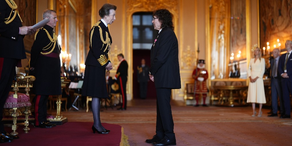 RoyalFamily's tweet photo. Congratulations to everyone who received honours at today’s investiture ceremony hosted by The Princess Royal at Windsor Castle. 🎖️👏

Amongst recipients were...

🎸 Lead guitarist and Co-Founder of @BlackSabbath, @TonyIommi MBE for services to music and to charity.

🏅Campaigner Natalie Cumming MBE for services to Holocaust
Remembrance and to the Missing People Charity.

👮Detective Superintendent, States of Jersey Police, Alison Fossey MBE for services to Island Policing and to the wider community of Jersey.
