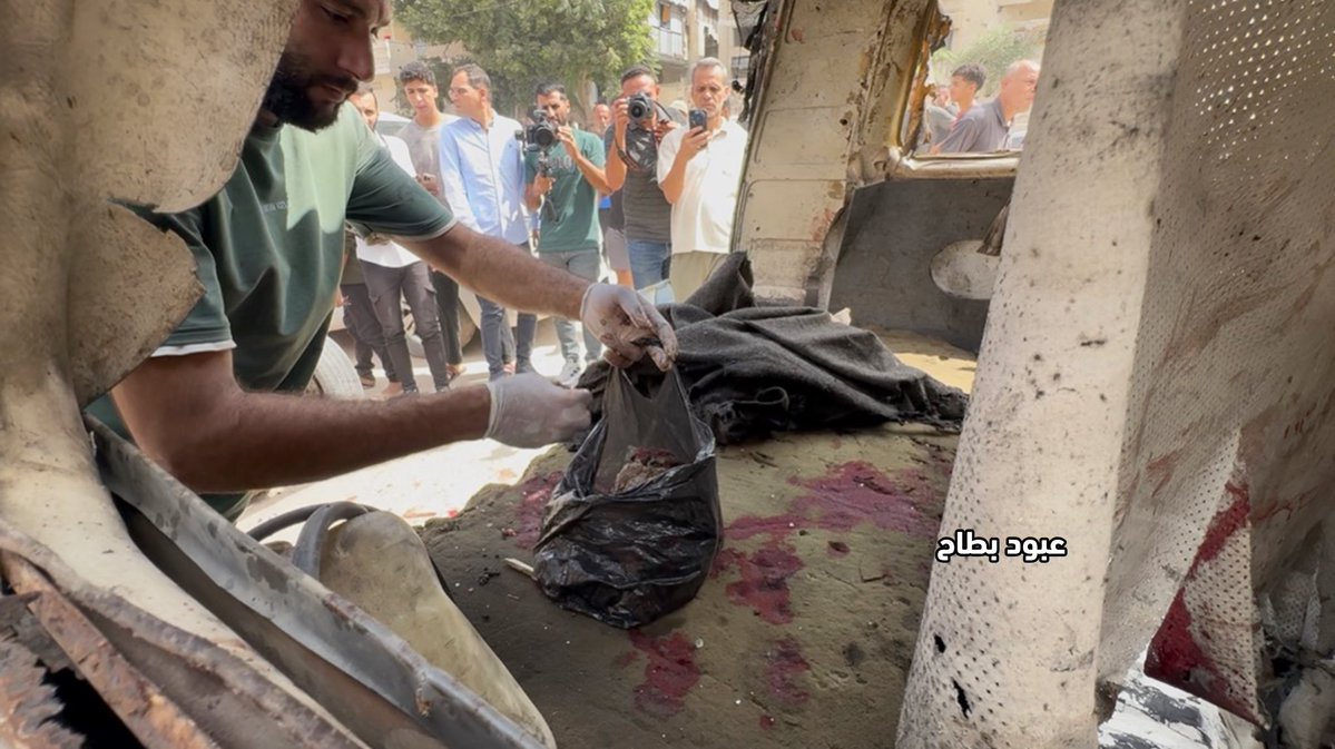 abod_bt's tweet photo. Residents are collecting the remains of the victims and fragments of their bodies from the street, in a scene that reflects the scale of the crime and the horror of what is happening.

What kind of brutality is this? What kind of cruelty allows someone to witness such a scene and remain silent?

In Tal al-Hawa, some of the victims were left as scattered remains along the road, while residents try to gather them, cover them, and preserve their dignity.

These are not just numbers… They are human beings with families, loved ones, and stories. Yet the war has left behind scenes that the heart struggles to comprehend.