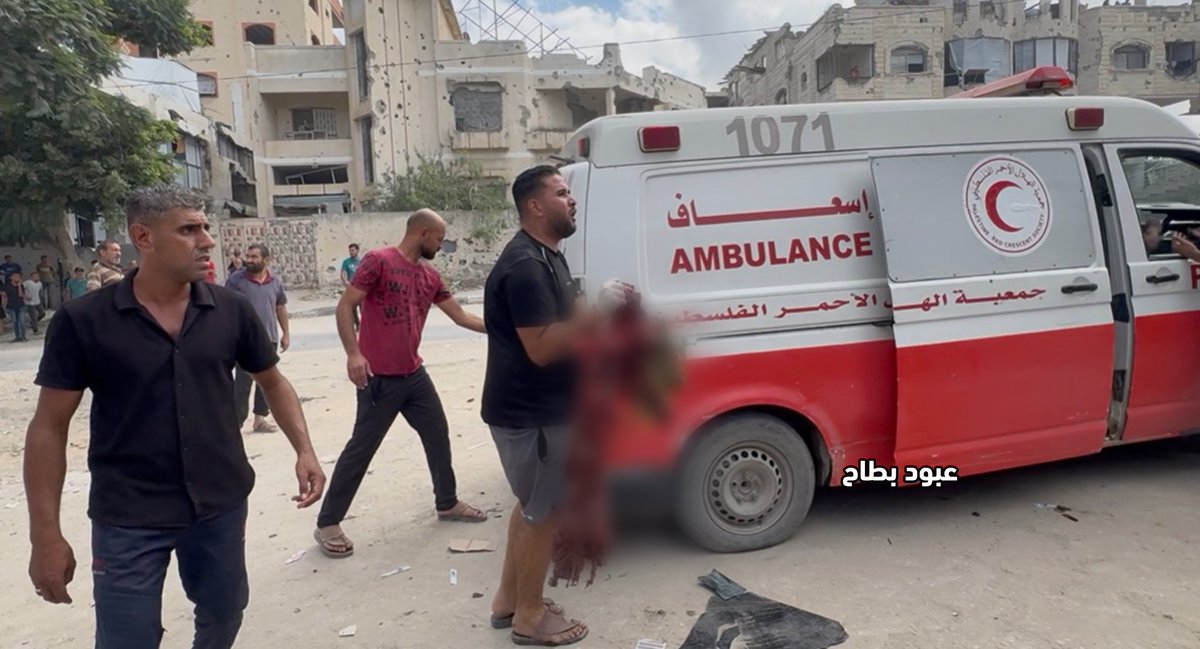 abod_bt's tweet photo. Residents are collecting the remains of the victims and fragments of their bodies from the street, in a scene that reflects the scale of the crime and the horror of what is happening.

What kind of brutality is this? What kind of cruelty allows someone to witness such a scene and remain silent?

In Tal al-Hawa, some of the victims were left as scattered remains along the road, while residents try to gather them, cover them, and preserve their dignity.

These are not just numbers… They are human beings with families, loved ones, and stories. Yet the war has left behind scenes that the heart struggles to comprehend.