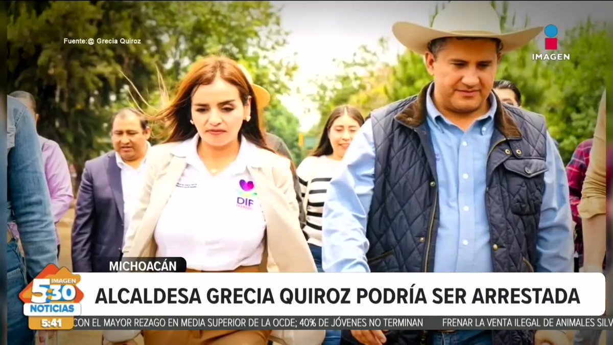 A news broadcast screenshot from Imagen Noticias with location tag 'MICHOACÁN' and headline 'ALCALDESA GRECIA QUIROZ PODRÍA SER ARRESTADA' (Mayor Grecia Quiroz could be arrested), showing a woman in a DIF shirt walking with a man in a cowboy hat.
