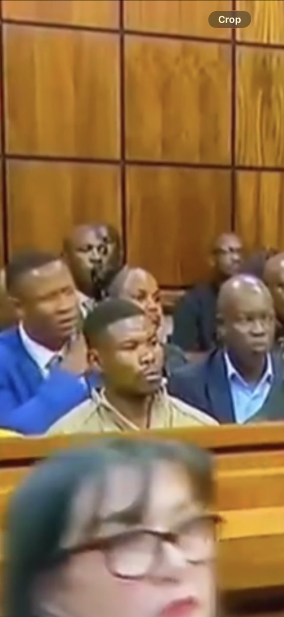HeidiGiokos's tweet photo. JUST IN: SAPS clarifies the video circulating on social media of someone in the gallery in court during the Sibiya matter doing a gesture with his hands. 

SAPS says the member is forms part of the Combat Team of the Commission’s Recommendations Task Team (CRTT).

SAPS says the gestures seen in the video were operational in nature. They were intended to communicate to the investigating officer that the protectors assigned to the prosecutors and investigators should take up their positions and remain on standby to facilitate the immediate departure from court after the announcement of the postponement of the bail proceedings.

The interaction therefore related to the coordination and positioning of SAPS personnel following the court proceedings. 

SAPS it was not intended to convey a threat, or an instruction to interfere with court proceedings.

SAPS says acknowledges that, when viewed in isolation, the gestures may understandably have caused concern or been open to misinterpretation. It is for this reason that SAPS considers it important to provide the necessary context and clarify the operational circumstances surrounding the interaction.

The officer has been reminded of the importance of exercising caution when using non-verbal communication, particularly in sensitive public and court environments where gestures may easily be misunderstood or interpreted out of context. 

 PHOTO SUPPLIED 

#ShadrackSibiya