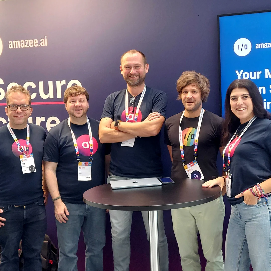 The amazee.io and amazee.ai team posing together at their exhibition booth during DrupalCon Rotterdam 2026