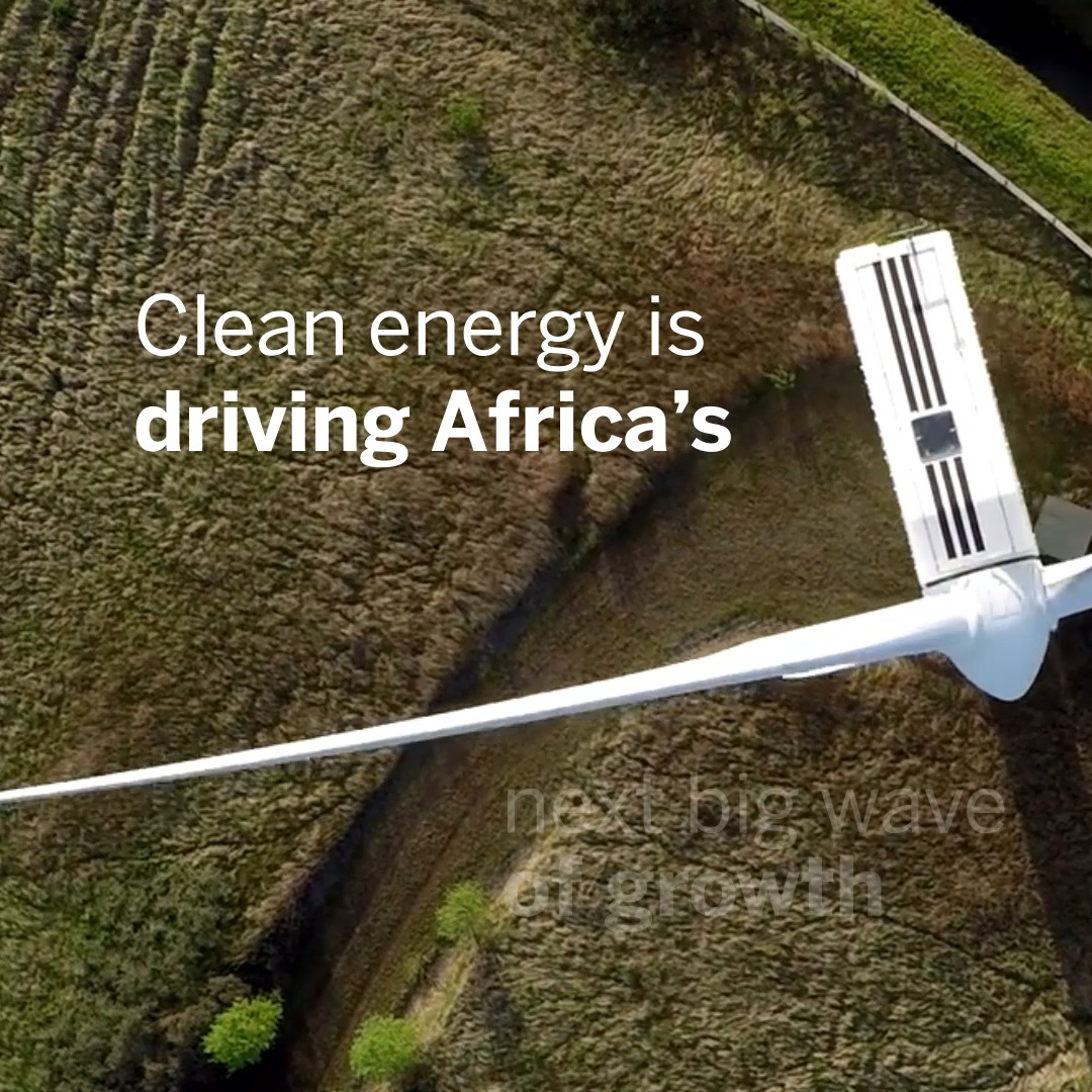 An aerial view of a wind turbine with the text 'Clean energy is driving Africa's next big wave of growth' overlaid in white.