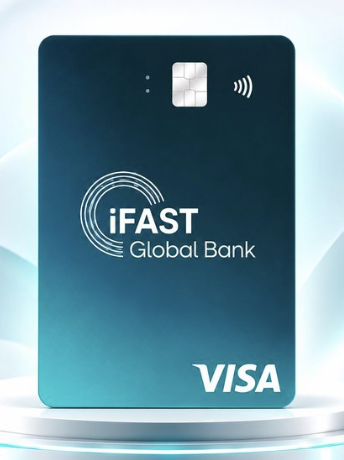 The image shows an iFAST Global Bank Visa card with a teal-to-dark blue gradient design, displayed on a podium. The card relates to the post's warning about using the iFAST card responsibly, as the author advises against using fake or overseas addresses to obtain it, sharing their experience of having an Interactive Brokers account closed after using N26's bill as proof of address.