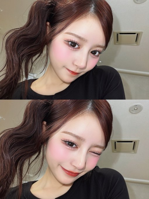 Two selfies show a young woman with reddish-brown hair in pigtails, wearing pink blush and winged eyeliner, smiling and posing in front of a plain wall with an outlet.