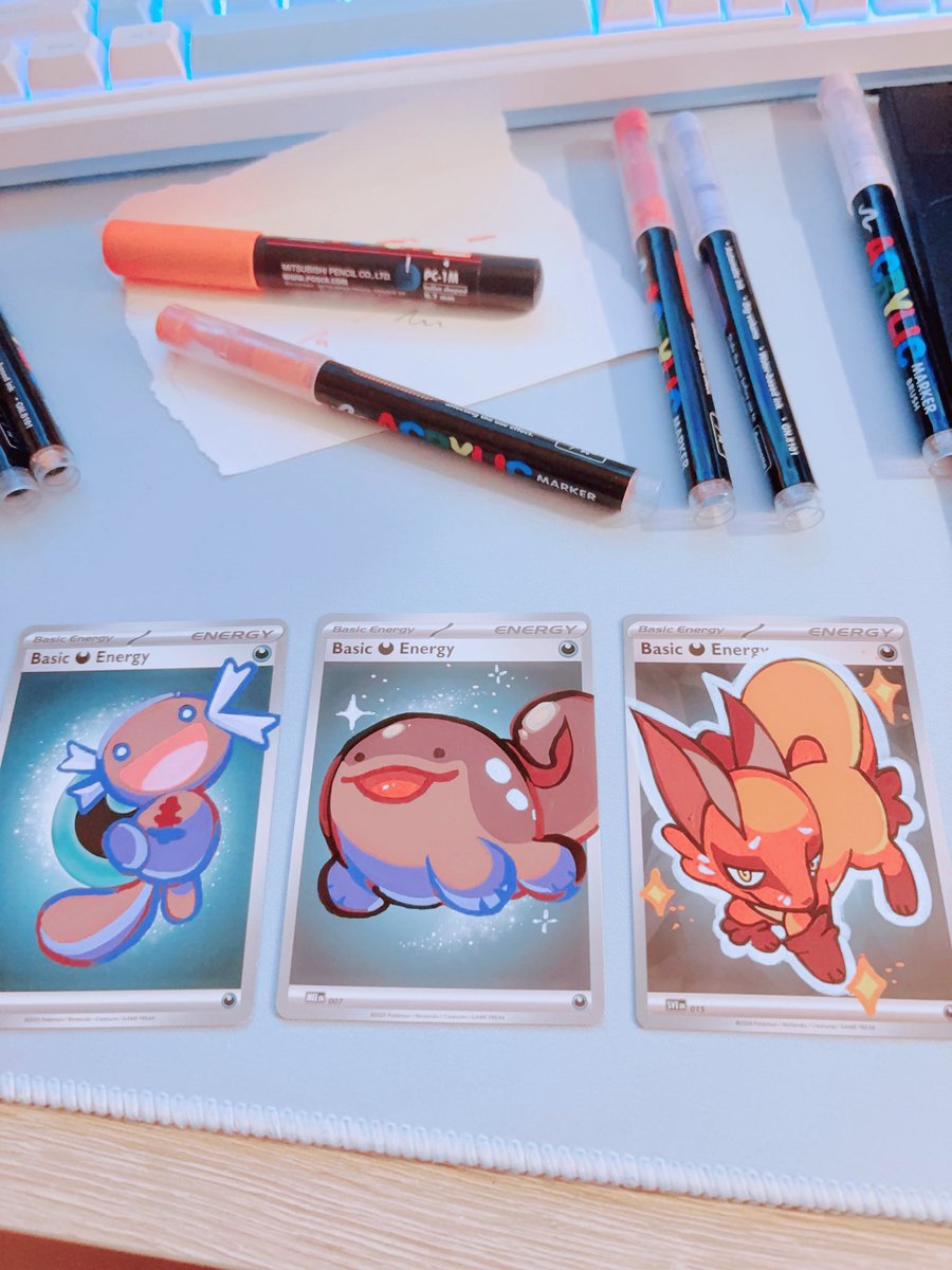 Kajackies's tweet photo. I forgot to show these custom painted cards! 🩵

I just love how some pokemon have so many schemes behind their eyes and some have… none. https://t.co/n3hH6MDhVr