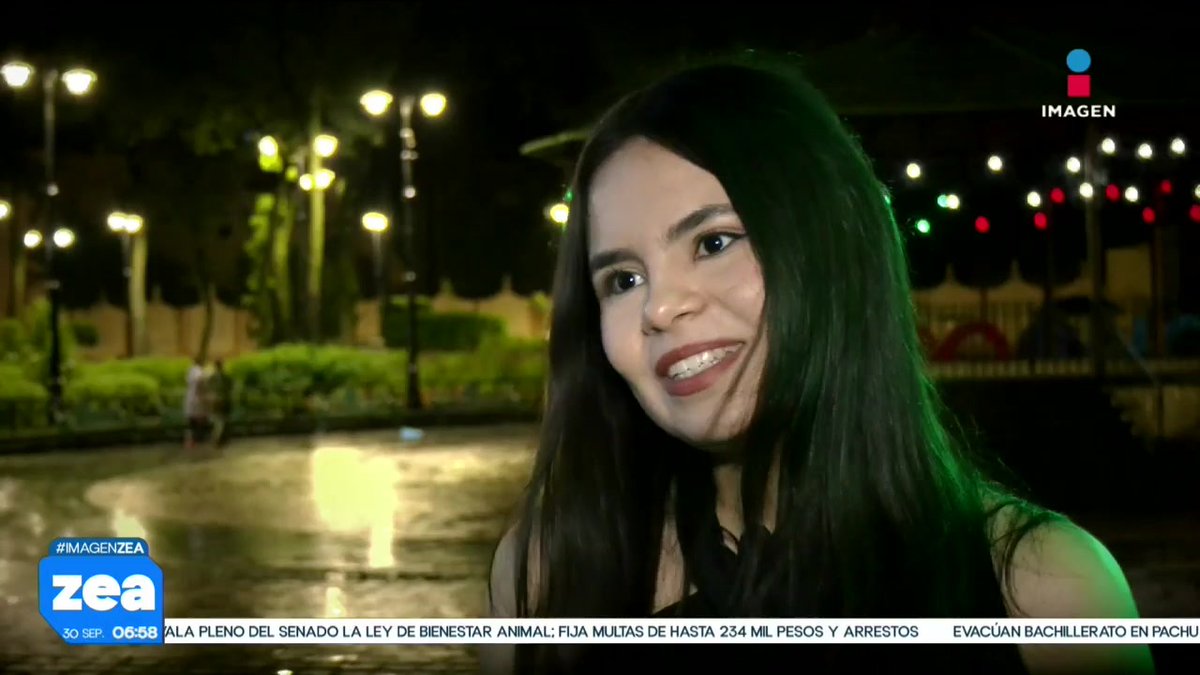 A nighttime news report screenshot from 'IMAGEN' (#IMAGENZEA, 'zea', dated 30 SEP 06:58) featuring a young woman smiling outdoors near a plaza, with a news ticker referencing Mexico's Senate approving an animal welfare law.