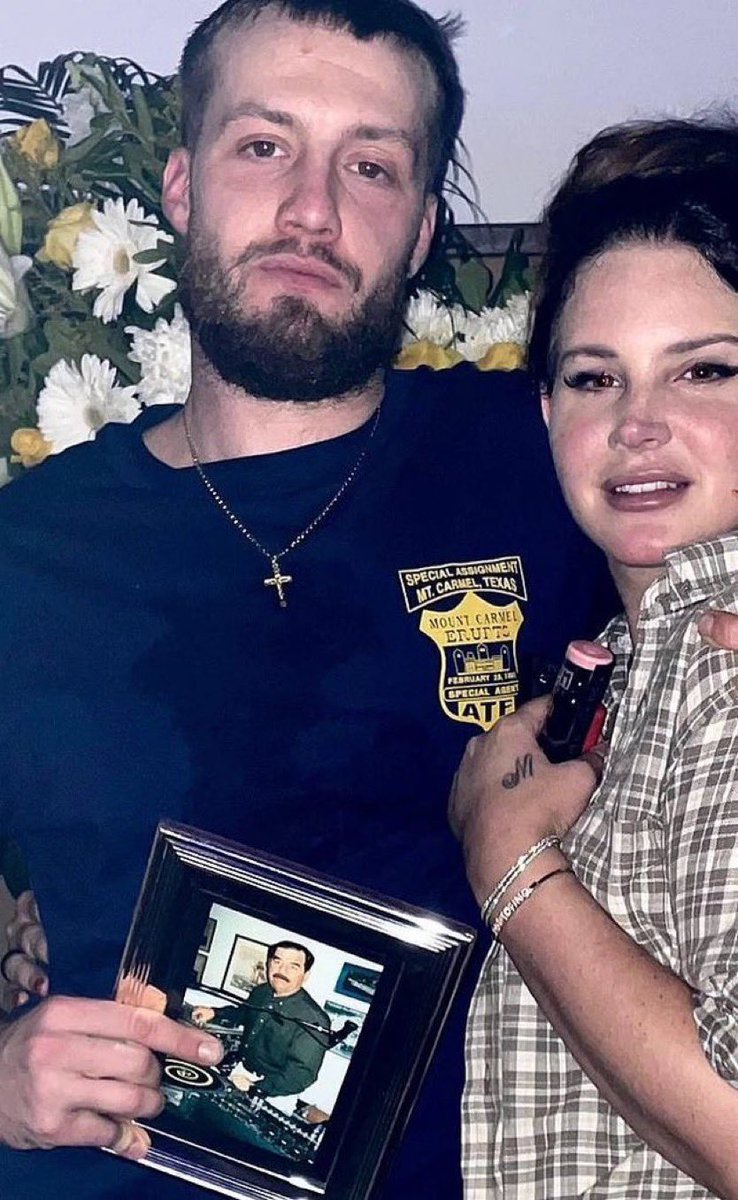 greatestptl's tweet photo. this photo holds so much mystery like why is lana's boyfriend holding a framed picture of sadam hussein https://t.co/Bg4w3vqzYl