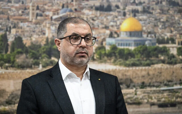 Schandillia's tweet photo. This is Basem Naim.

Shortly after the 2006 elections, when Hamas’ Ismail Haniyeh briefly became Palestine’s PM, Naim entered his service as his bodyguard.

Why briefly?

Because while Hamas is a benign political party participating in routine democratic processes, it also has a military wing called Izz al-Din al-Qassam Brigades which is very...not-benign.

President Abbas wanted Haniyeh to dismantle this terrorist wing and recognize Israel.

Haniyeh refused.

And got sacked.

What followed was a bloddy civil war between Fateh (Abbas’ party) and Hamas (Haniyeh’s party) in the streets of Gaza. And Gaza is where Haniyeh was. Naim’s job was to keep Haniyeh safe.

In 2012, however, Naim resigned and moved to Egypt. A few years later, onward to UK. Where he applied for asylum citing “persecution” by Egypt.

Hmmm...an ex bodyguard to a rogue leader of a terrorist leader in a geography battered by terrorism seeking asylum? No way that’s happening, right?

It did.

To reiterate, al-Qassam Brigades was already listed as a terrorist organization by not only US, EU, and UN, but also separately by UK.

A literal terrorist was now a British asylee. But so what, don’t people deserve a second chance? Of course, Naim had reformed. Having long given up arms, our man was now working as an IT consultant living in an English suburb like any goody-two-shoes asylee.

Years pass. Naim is now a citizen.

Then comes 2021 and UK expands its terrorist designation from just the Brigades to the entirety of Hamas. Zero tolerance to terrorism. If your military wing is a terror group, so are you.

Not Naim. He’s long reformed. No reason to suspect him, let alone interrogate. So what he’s still publicly in contact with Hamas, now a designated terrorist organization? He didn’t do anything personally, right? All he did was do his 9-5, buy his groceries, go to bed...like any other Brit.

Until one day he didn’t.

In 2025, a joint operation by Mossad and German and Austrian agencies uncovered a plot to kill a large number of jews in coordinated terrorist attacks throughout Europe.

By Hamas.

A large weapons smuggling network was part of the plot. Guess who was found to be transporting firearms and ammunition between Berlin and Vienna!

During the investigation, the authorities recovered a pre-recorded “martyrdom” video. In the footage, Naim had filmed himself declaring that the planned attack was at the behest of the al-Qassam Brigades. Based on this intel, an arrest warrant was issued in Germany in October 2025.

Acting on which, UK’s NCA arrested him in Central London the following month.

But he remains a citizen of UK and never named in any British media outlet. Instead, you’ll see a mysterious Mr. X all over the news. Why?

Because the same year a Westminster Magistrates’ Court judge passed an order that barred publication of his name for 100 years. So the papers and TV channels named him Mr. X.

This absurd restriction has recently been challenged by The Times and, I hear, successfully so. So hopefully, we’ll start seeing more of Basem Naim and less of Mr. X in British media in coming days.

So this is how UK treats terrorists. If you’ve ever been denied a visa for travel or work, consider Naim’s “unconventional” route.
