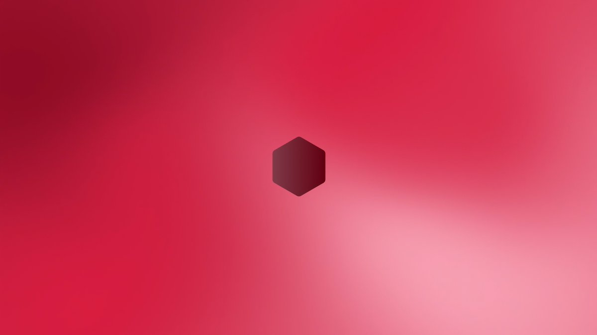 A simple minimalist image featuring a dark hexagon shape centered on a gradient red and pink background.