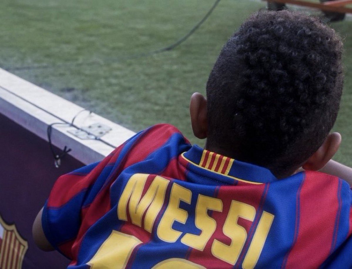 fcbmessiaddict's tweet photo. Apparently this is a young Jude Bellingham at Camp Nou wearing a Leo Messi jersey… Is this actually true? 😂 https://t.co/EIRNo1UM40