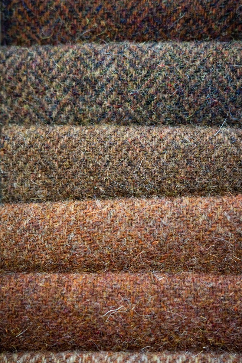dieworkwear's tweet photo. Harris Tweed is a protected name, regulated by the Harris Tweed Authority, which requires the cloth to be handwoven in the Outer Hebrides from pure virgin wool that has been dyed and spun there. It's the most well-known tweed and perhaps the one most people will encounter, as it's abundant in thrift shops. The material has a lovely heritage, but if I'm being honest, it's also my least favorite tweed because it's very itchy and scratchy, owing in part to the coarse wool used to make it. 

There are other tweeds are named after regions, such as Donegal (though no governing body regulates it, so it's more likely to be abused). Technically speaking, Donegal tweed should be woven in County Donegal, Ireland, although it's not uncommon to see people use the term to refer to any tweed with flecks of color, regardless of where it's produced. 

However, some tweeds are woven from different types and grades of wool. Lovat Mill mostly uses Shetland wool, which is much softer than Harris Tweed and has an appreciable loft (slide one). That sponginess can also affect tailoring, as it slightly changes the silhouette.

In slide two, we see Fox Brothers tweed, which is softer still. Some of these are so soft, you can almost mistake them for woolen flannel, for which the company is best known. 

In the third slide, we see Holland & Sherry's Sherry tweed, which is the softest tweed I've come across. These are made from lambswool and feel more like sweaters.

In the fourth and final slide, we see some "tweeds" woven by the Italian mill Vitale Barberis Canonico. These rely more heavily on worsted yarns than the woolens shown in the previous slides. To me, their modern coloring and worsted nature make them barely tweeds, although the fabrics are packaged and marketed under the name "Tweedly."

Point being: if you've ever felt tweed and didn't like the feel, consider that maybe you just felt one type, likely Harris. It's among the coarsest and scratchiest of the tweeds. But much like tomatoes, which come in different varieties that differ in shape and sweetness, so too does tweed.