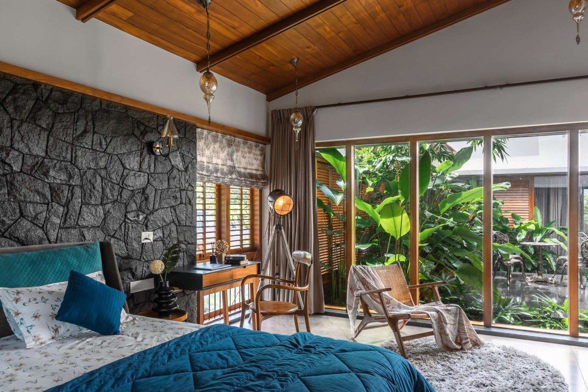 shavnyuyngah's tweet photo. Look at how many openings this house has, then ask why yours has so little.

HAYA sits in Wandoor, Kerala, built as a single storey around a central courtyard with a water feature at its heart. Big glass openings and wooden shutters run through the whole plan, so light pours in and every bedroom, including the master suite, looks out onto that courtyard instead of a blank wall.

The roof does real work too. Kerala clay tiles, no cornices, just a clean sloped line. That absence of ornament isn't a gap, it is restraint, and clay itself carries thermal mass that keeps the interior cooler through the day, the same climate logic we live under here.

This is built for the exact heat and humidity we deal with. So why do our own homes still get built with small windows and sealed-off rooms, in the same climate this house was designed to breathe in?

More images from this one are in the thread below.

Wandoor, Kerala, India. Architect: Farsa Buildesign. Completed 2023. Photography: Marc Frames.