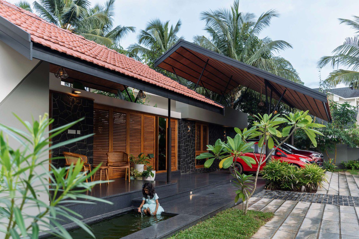 shavnyuyngah's tweet photo. Look at how many openings this house has, then ask why yours has so little.

HAYA sits in Wandoor, Kerala, built as a single storey around a central courtyard with a water feature at its heart. Big glass openings and wooden shutters run through the whole plan, so light pours in and every bedroom, including the master suite, looks out onto that courtyard instead of a blank wall.

The roof does real work too. Kerala clay tiles, no cornices, just a clean sloped line. That absence of ornament isn't a gap, it is restraint, and clay itself carries thermal mass that keeps the interior cooler through the day, the same climate logic we live under here.

This is built for the exact heat and humidity we deal with. So why do our own homes still get built with small windows and sealed-off rooms, in the same climate this house was designed to breathe in?

More images from this one are in the thread below.

Wandoor, Kerala, India. Architect: Farsa Buildesign. Completed 2023. Photography: Marc Frames.