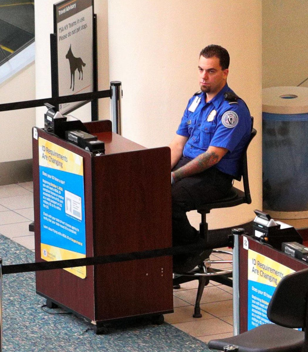 pubity's tweet photo. The TSA has banned employees from sitting down while checking passports and IDs.

They believe seated TSA agents don't create a "welcoming and professional environment for travelers" and will now force agents to stand for the whole shift. https://t.co/7pFXt32fPp