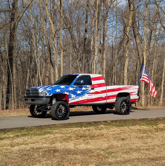 DavidJHarrisJr's tweet photo. 🚨WOW: A 17-year-old high school student stands his ground after being suspended for refusing to remove American flags from his truck!

Cameron Blasek, a senior at East Central High School in Indiana, arrived at school with full-sized American flags flying proudly from the bed of his pickup truck.

School administrators called Cameron into the principal's office, claiming the flags violated school rules and ordering him to take them down immediately.

When Cameron firmly refused to remove Old Glory, the school slapped him with an in-school suspension and threatened further disciplinary action.

Word of the suspension spread like wildfire across the community, sparking massive outrage among local parents, students, and community members who rallied behind his right to display the flag.

The very next morning, dozens of students rolled into the school parking lot with giant American flags mounted to their trucks and cars in an overwhelming show of solidarity.

Faced with massive pushback, the school district backed down, lifted the suspension, and officially reversed its policy to allow students to display American flags on their vehicles! 

This is what his truck looks like today!🇺🇸👏🏾