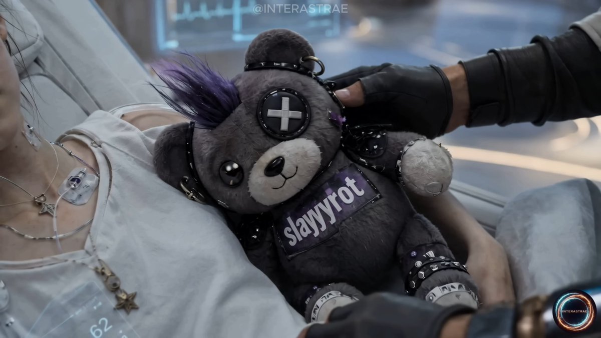 AlaranFan's tweet photo. In Chapter Two of the web series Alaran, Dr. Adrian Vale's sick sister has a teddy bear of the fictional heavy metal / rock band SLAYYYROT.
📽️Watch Chapter Two for free on YouTube https://t.co/rLUpcYcUOu

SLAYYYROT were performing on the streets of Meridian City on the planet Meridia earlier in the Chapter Two.
I hope she makes a full recovery later on the in the story, SLAYYYROT get released from jail (they got arrested by Helix Dominion) and she can watch them perform live!

#ai #storytelling #detail #worldbuilding #film #series #shortseries #sick #illness #cyberpunk #fantasy #suno #seedance #fantasy #imagegeneration #music #rock #metal #band #AIart #art #relationships #family