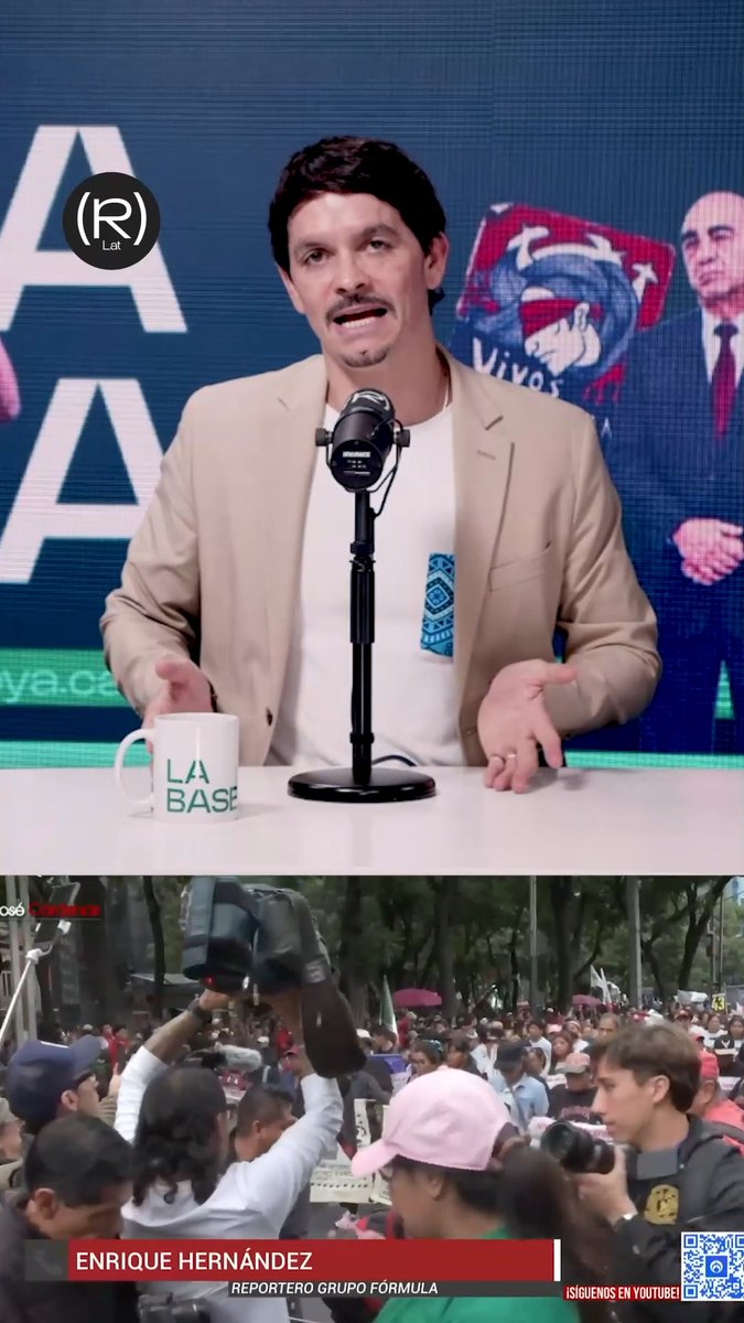 A news broadcast screenshot from "La Base" shows a man in a beige blazer speaking at a microphone with a "La Base" mug, while the bottom panel displays reporter Enrique Hernández of Grupo Fórmula covering an outdoor protest with crowds and police. The watermark "(R) Lat" and hashtag #NOTICIAS / #ULTIMAHORA indicate a breaking news segment contrasting studio commentary with on-the-ground protest coverage.