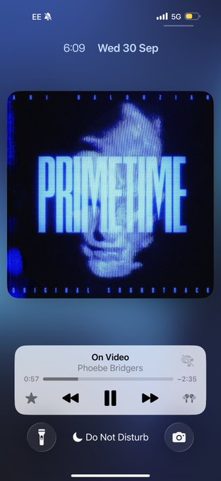 An iPhone lock screen showing the time as 6:09 on Wed 30 Sep, with 'On Video' by Phoebe Bridgers playing on the music widget and a 'PRIMETIME' cover image displayed.