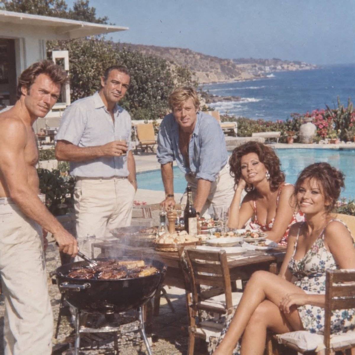 ChonlozB's tweet photo. 🌊 Malibu, 1965 — Clint Eastwood, Sean Connery, Robert Redford, Sophia Loren and Claudia Cardinale enjoying a relaxed summer barbecue by the Pacific. No premieres, no cameras—just five Hollywood legends sharing a beautiful afternoon by the sea. ☀️ https://t.co/SA3k8yaGBO