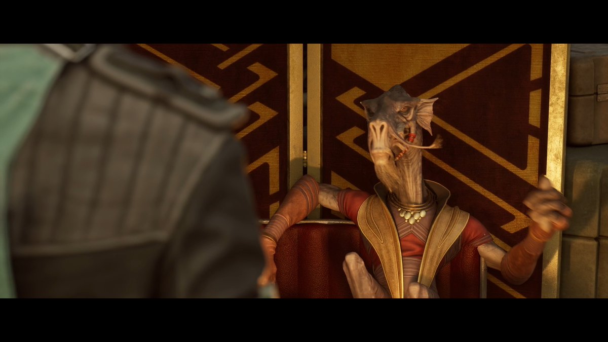 A character from Star Wars, an alien with facial tentacles, sitting on a throne in ornate clothing.