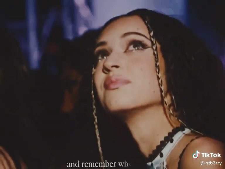 A close-up TikTok video still of a woman with braided hair, with the username @.stb3rry and partial caption 'and remember wh'.