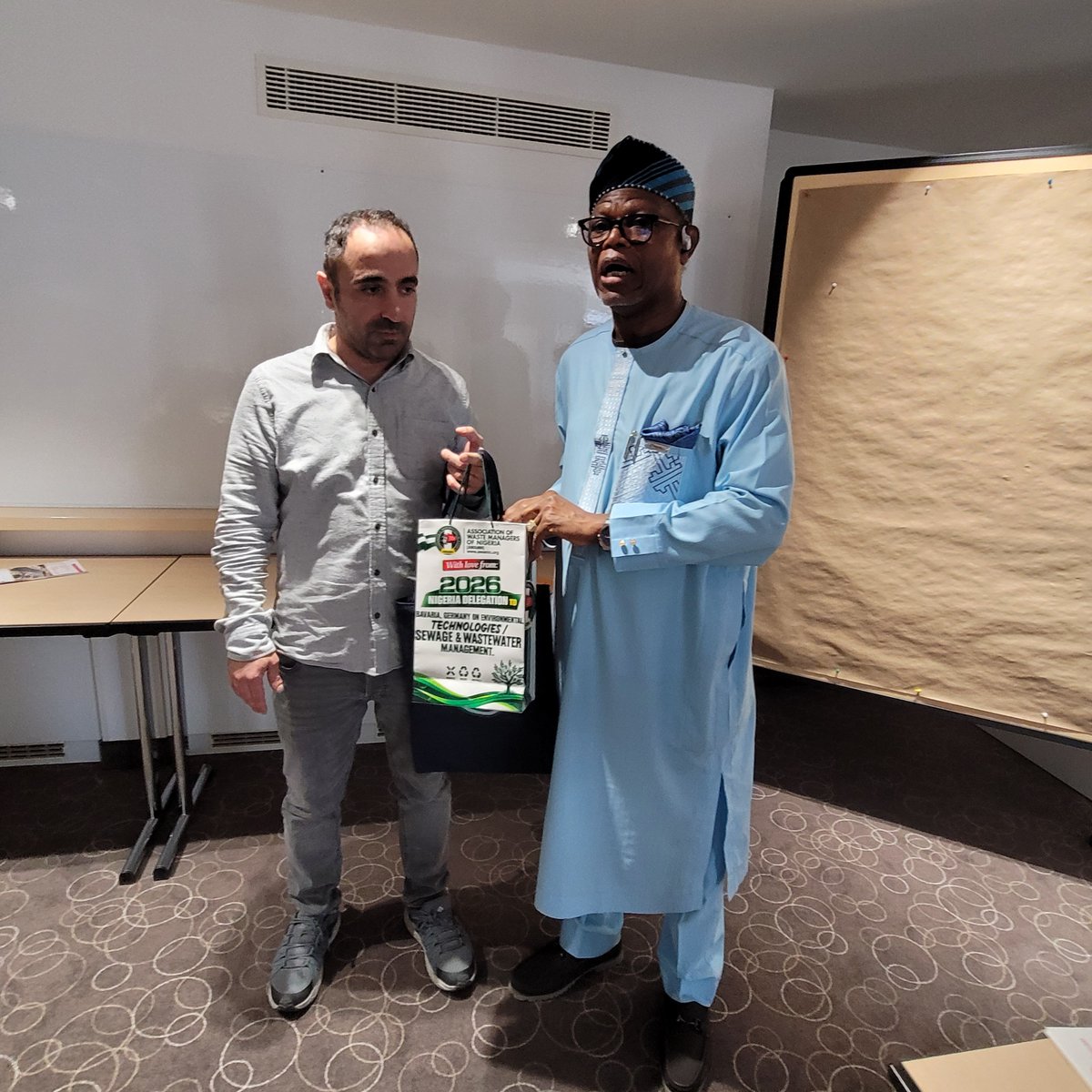 AdebolaGb's tweet photo. 🇳🇬🇩🇪 From Lagos, Nigeria to Nuremberg, Germany — The Future of Waste is Intelligent!

The Nigerian delegation on Technical Study Tour to Bavaria, Germany on Environmental Technologies, Waste Management, Circular Economy and Sewage/Wastewater Management led by the National President of the Association of Waste Managers of Nigeria (Dr. Olugbenga Adebola arrived safely in Lagos over the weekend.

The 10-Day insightful and highly educational Technical Study Tour in Bavaria, Germany,

A major highlight at the Deutsches Museum Nürnberg – Das Zukunftsmuseum was the insighting engaging conversation of Dr. Olugbenga Adebola with *AMECA*, the world's most advanced humanoid robot.

They discussed waste & wastewater management, technological innovations, and the role of AI in driving a circular economy. It was fascinating to see how the future museum connects robotics, ethics, and sustainability — The uncommon privileged of chatting with Ameca about waste management & tech innovations confirmed what we know at AWAMN: Technology + Good Governance = Clean Environment - We will achieve it soon in Nigeria through total commitment and sincerity of purpose both from the Government, Operators and the Public.

Germany has shown us that waste is not waste until we waste it. With smart tech, governance, and political will, we can professionalize private integrated waste management in Nigeria for sustained progress.

We look forward to sharing these global insights, the take home for the delegation and key lessons for Nigeria 

A special thanks to the Bavarian Ministry of Economic Affairs, Regional Development and Energy - for funding the Study Tour on yearly basis, The German Consulate General in Lagos, Nigeria - for granting entry visas to the delegates, Bildungswerk der Bayerischen Wirtschaft (bbw) GmbH -  for coordinating/facilitating the program and partnering with the Association of Waste Managers of Nigeria (AWAMN) to facilitate/coordinate the Bavarian Technical Study Tour in Nigeria.

To this year's delegates, I hope you all will put into action practical knowledge and experience gained during this year's Study Tour in Nuremberg.

♻️ The future is circular. The future is now.

#AWAMN  #WasteManagement #WastewaterManagement #Lagos #LSWMO #SewageTreatment #CircularEconomy #Bavaria #Germany #Nuremberg #BBW #Zukunftsmuseum #Ameca #EnvironmentalTechnology #Sustainability #Nigeria #LAWMA 
#WasteManagementResourceCentre #WMRC