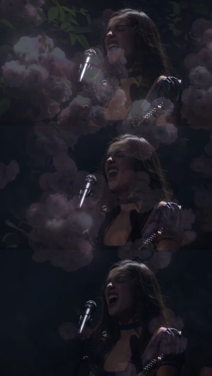 A triptych of frames showing a woman singing passionately into a microphone, surrounded by pink blossoms in a dark, dreamlike setting.