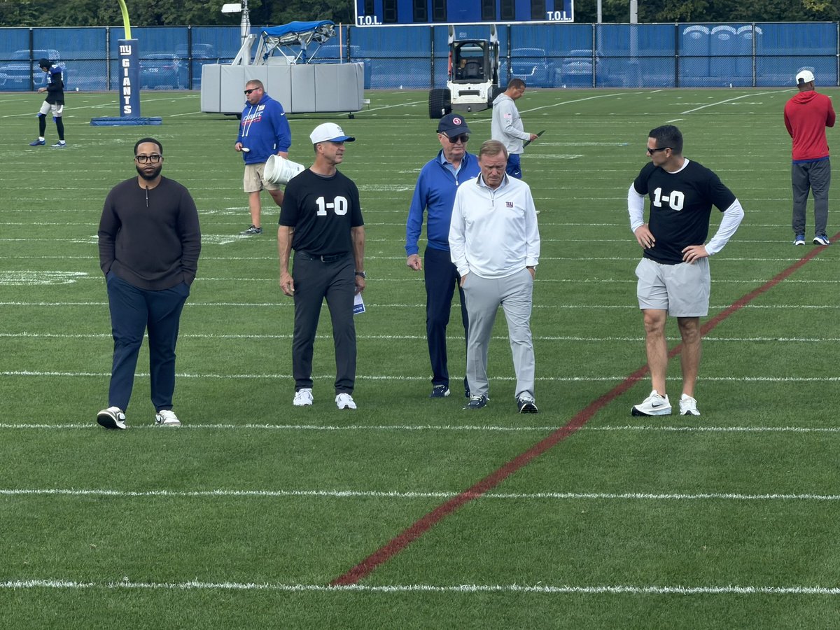 Connor_J_Hughes's tweet photo. #Giants coaches, GM Joe Schoen wearing a “1-0” shirt.

A message to team. 

Also awesome to see John Mara here https://t.co/SRRcrNsxAq