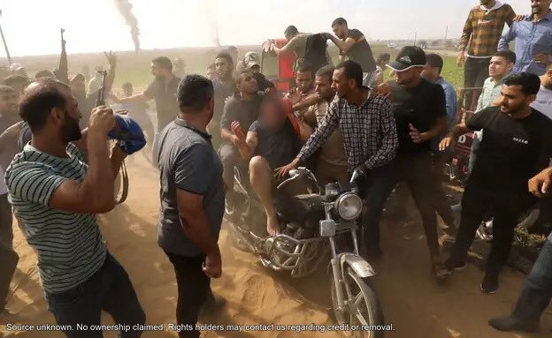 Brightmind_ME's tweet photo. 🚨⚠️TRIGGER WARNING🚨⚠️

A bloodied Israeli man is kidnapped into Gaza on October 7, shielding himself as captors and onlookers crowd around him, film him, and strike at him with joy.
 NEVER AGAIN!
 For more factual, freely available information, go to link in bio. https://t.co/JEW4EZN0QF