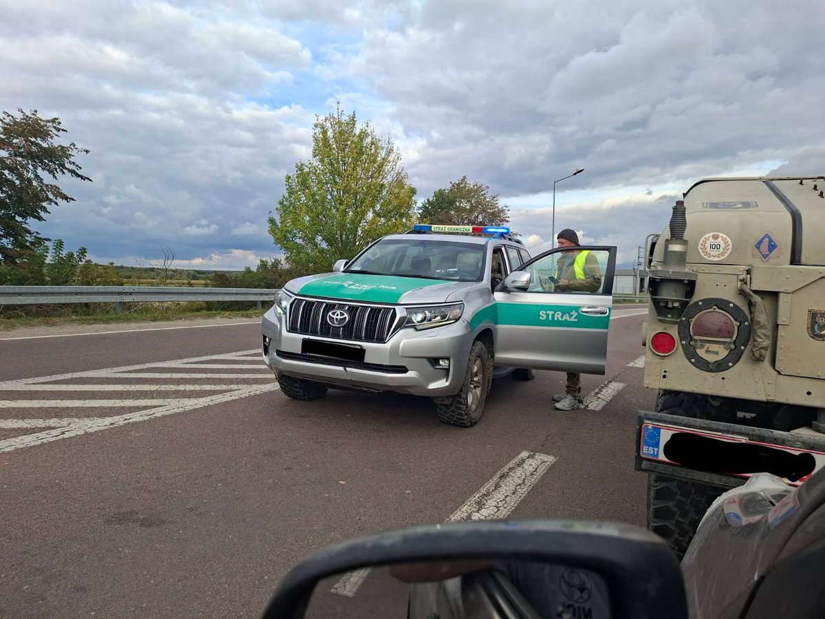 trinzu's tweet photo. MAXIMUM REPOST PLEASE. Here is a story about what happened to my friend in Poland, because maybe this reaches someone who can actually help.

My friends from SAB UA spent almost two years getting an American HMMWV from Canada to Ukraine. This was not some random military vehicle driven across Europe without paperwork. It has an American re-export licence confirming it is demilitarised and allowed for civilian use, Canadian export documents, Estonian import/export licences, declarations, end-user certificate, request from the Ukrainian military unit and Canadian civilian registration.

Basically a mountain of paperwork.

But because the HMMWV was originally manufactured for the military, one document still contains the classification ML6.a. And this tiny code became a very big problem in Poland.

The convoy arrived at the Polish border last Thursday. Five vehicles passed, but the HMMWV and my Estonian friend Jan Laar, who volunteered as the driver, were detained.

And not for a few hours.

The first night Jan slept inside the HMMWV. Food and water eventually ran out and at one point he literally ate cat food with mineral water because that was what he had. There was no proper toilet and the nights are already cold.

Later another shift moved him into a tiny holding cell, allowed him to buy food, shower and even order pizza. And then somehow he was basically forgotten in that cell for two days, until Monday when management came back and someone finally dealt with the situation. His passport and documents had also been taken.

Altogether my friend spent around five days there.

Jan is not a criminal, smuggler or someone transporting military equipment for profit. He is an Estonian and EU citizen who volunteered his own time to drive aid more than 2,000 km toward Ukraine.

On Monday he was finally released and thankfully there is no huge fine or criminal case. But the HMMWV is still detained in Poland.

SAB UA has now been told they need another document from the Polish Ministry of Development and Technology, either permission allowing transit through Poland and import into Ukraine, or confirmation that such permission is not required.

The answer can take one month. Potentially two.

Meanwhile the vehicle sits there while Ukrainians who were supposed to receive it are waiting.

Nobody is asking Poland to ignore its laws. But something is seriously wrong when volunteers can spend almost two years obtaining American, Canadian, Estonian and Ukrainian documents and still discover at another EU border that one classification means another national permit is required.

So MAXIMUM REPOST please.

We need this to reach someone in Poland who can actually help: Ministry officials, diplomats, customs or strategic-goods specialists, lawyers, volunteer organisations, Estonian or Ukrainian representatives, or anyone who has dealt with ML6.a transit permits.

If you know someone, please tag them, share this or connect them with SAB UA.

The HMMWV needs to get out of Poland and to the Ukrainians waiting for it. 🇺🇦

Original post with the full story:
https://t.co/rzfUAaM726