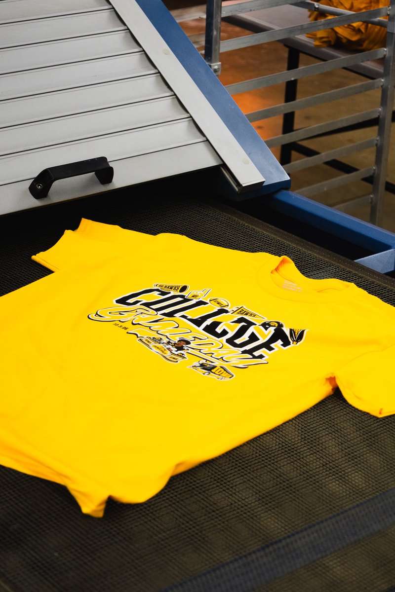 IowaNILStore's tweet photo. Our production facility is churning through College GameDay merch! It’s all headed our way. 

Check out merch at Scheels, Rally House, the Iowa Bookstore and The Black &amp; Gold Shop this weekend. 

If you’re not in the area, shop here: https://t.co/SzJFURezUn https://t.co/VifEreehVZ