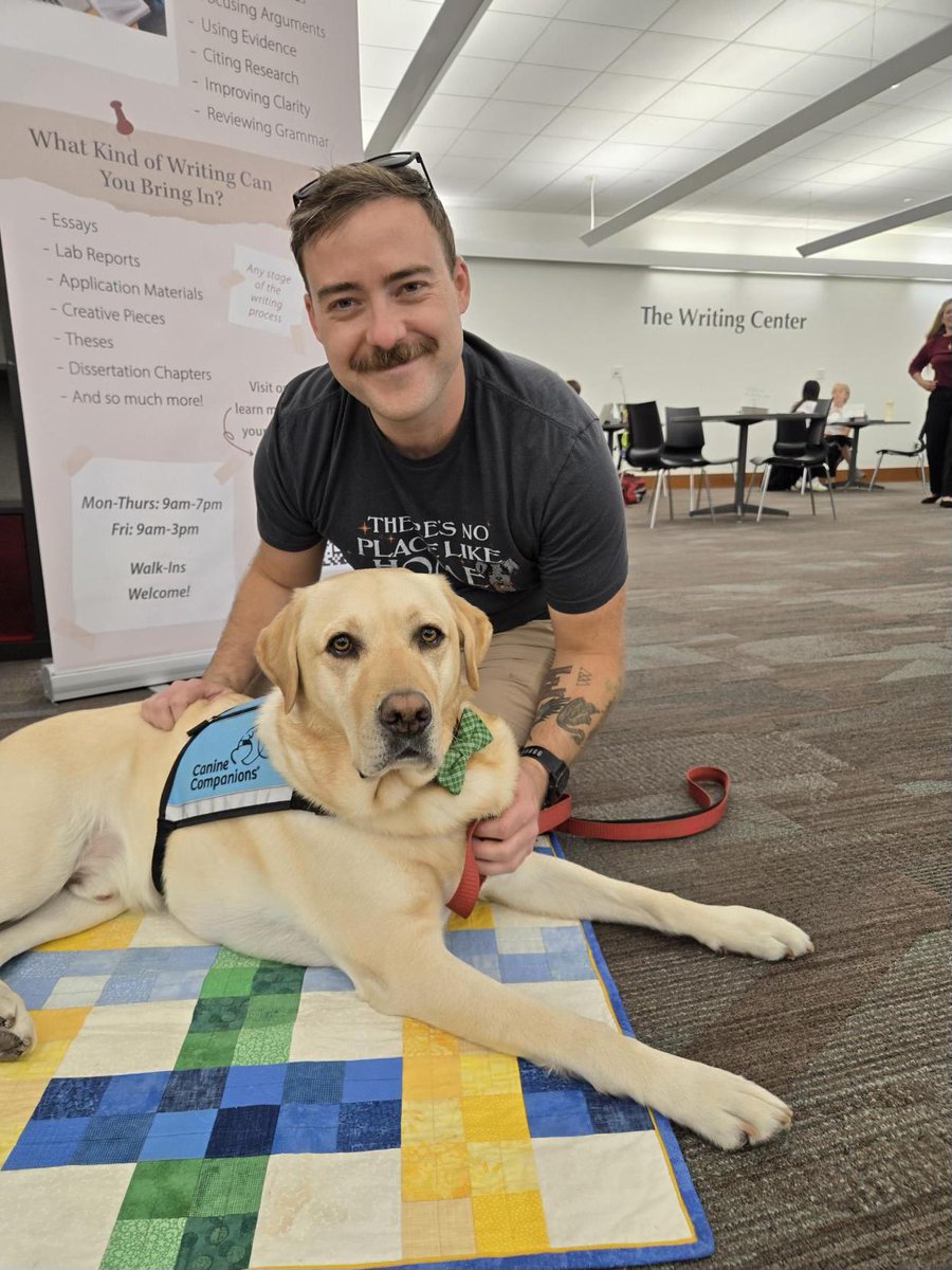 MarriottLibrary's tweet photo. Homer is at the library helping us celebrate the new Writing Center location! Come check out the new space and visit this handsome guy! 🦮🐾 https://t.co/S4LFIEv5ag
