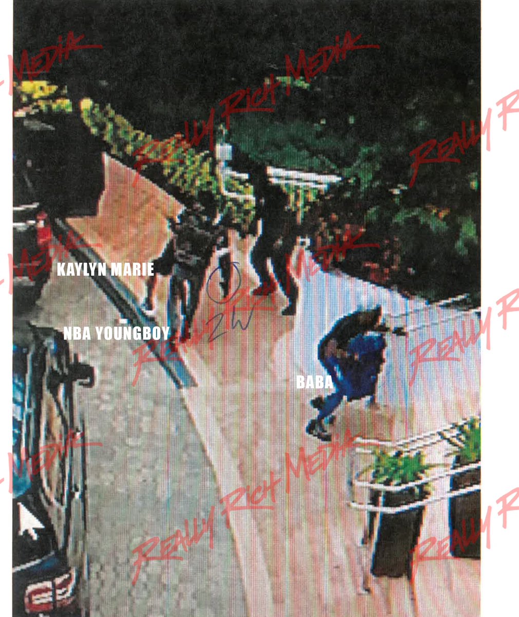 ReallyRichMedia's tweet photo. 🚨 NEVER-BEFORE-SEEN: NBA YoungBoy during the 2019 Rolling Loud shooting.
Surveillance shows YoungBoy carrying Kaylyn Marie after she was shot while holding a gun, laying her down to help her, then passing the weapon off.

NBA affiliates Baba & Ben10 can also be seen in the footage.