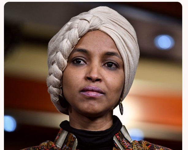 MelG_Gibson's tweet photo. 🚨BOOM:

Rep. Ilhan Omar is on the verge of tears and says she can’t be deported because she’s an American citizen.

SHE CAN BE DENATURALIZED. THEN DEPORTED.

Do you think Ilhan Omar should be denaturalized and deported?

YES or NO?

IF YES, give a THUMBS-UP 👍 https://t.co/9k5U2M67h9