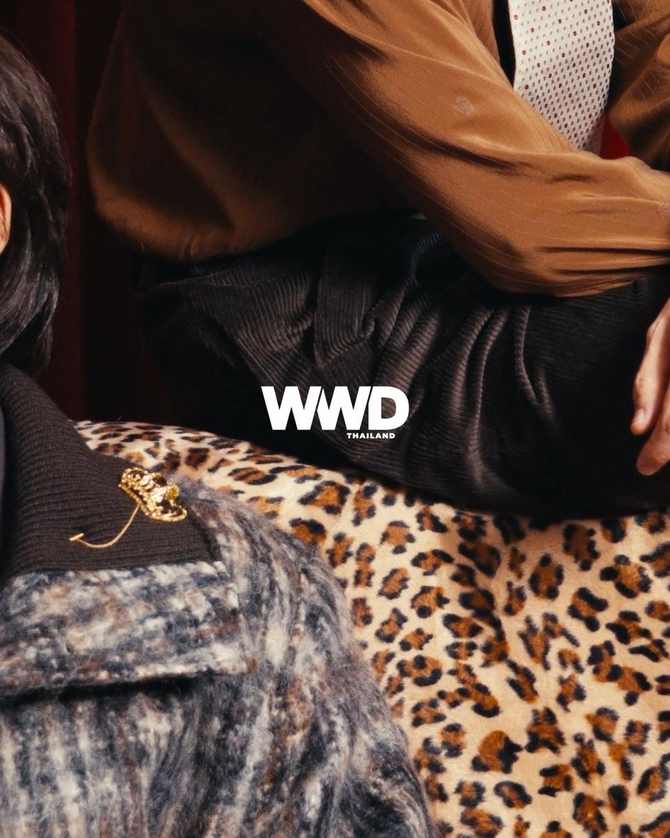 A fashion editorial spread features a close-up of models wearing Dolce & Gabbana attire, including a tan satin shirt and a leopard-print ensemble accented with a gold brooch, with the "WWD THAILAND" logo prominently displayed.