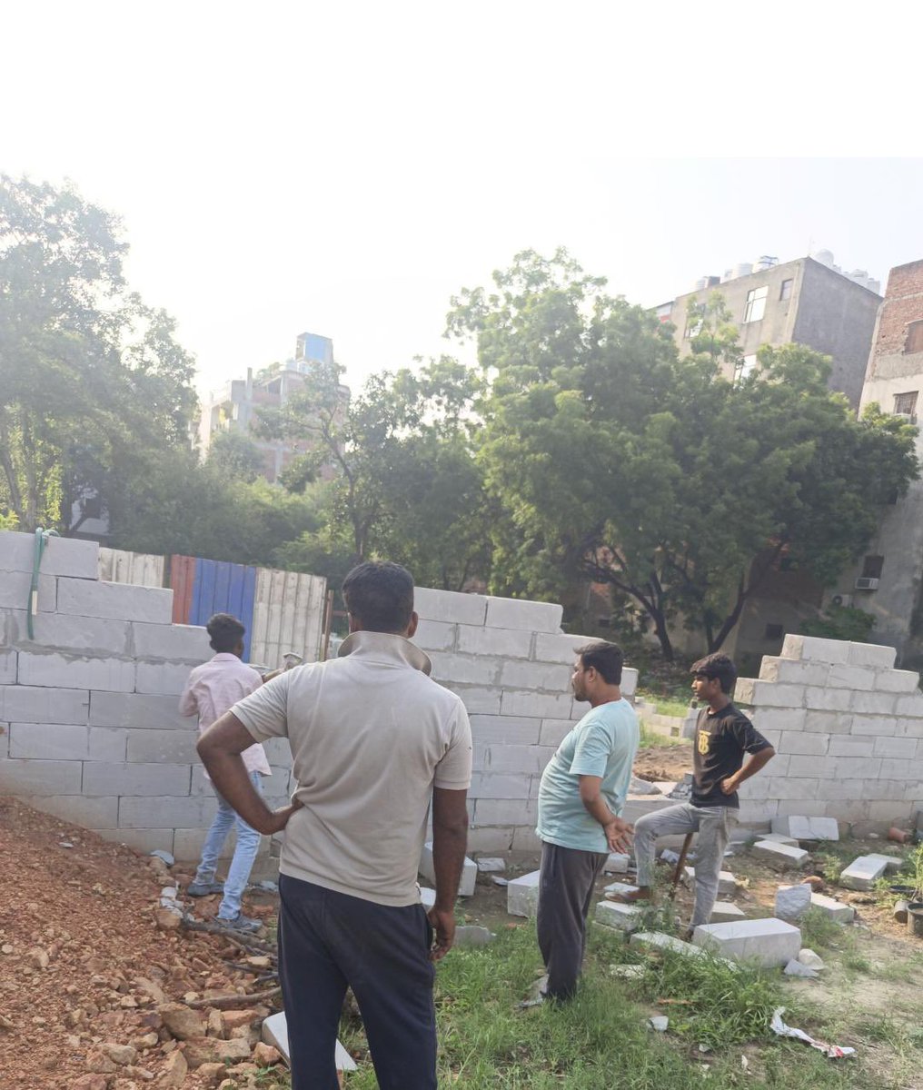 Saurabh_MLAgk's tweet photo. Big Breaking 

Forest land worth several hundred crores is being encroached under the patronage of Rekha Gupta Govt.
Under the guise of loudly playing out DJs,behind these illegal green/blue tin sheet walls, trees are being cut illegally, illegal walls are being erected overnight to encroach forest lands worth hundreds of crores.

At Chhattarpur 100 ft road & 60 Ft road near Shamshan Ghat , builder mafia is active under political patronage.  After development of few luxury malls in this area, the greed of politicians is growing like wild fire.

This is at the cost of ur lungs. BJP Govt gives bhashan on pollution, “ek ped Maa ke naam” , but in reality, thousands of trees are being illegally cut in this forest area. 

Environment & Forest Dept under Minister @mssirsa is responsible for protesting forests but it appears to be part of criminal conspiracy to loot forest land. 

All agencies are sitting quite - @DelhiPolice @MCD_Delhi @CMODelhi @LtGovDelhi