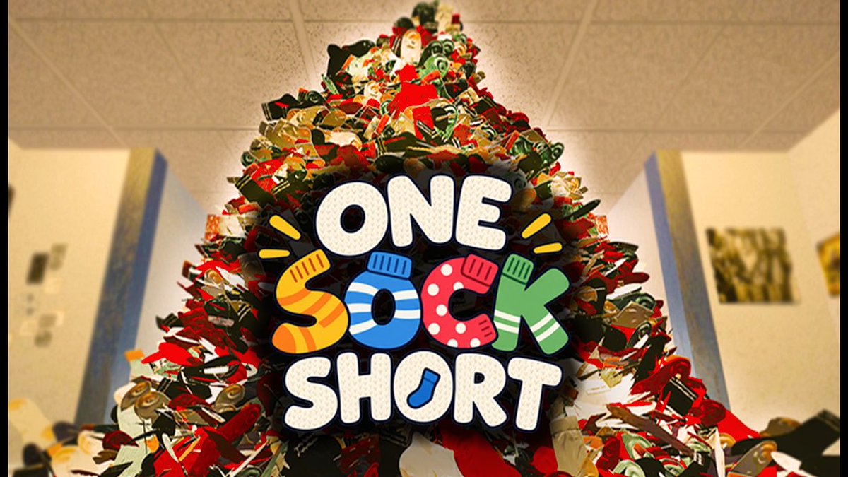 A colorful logo reads 'ONE SOCK SHORT' against a backdrop of a massive pile of colorful socks in what appears to be a bedroom setting.