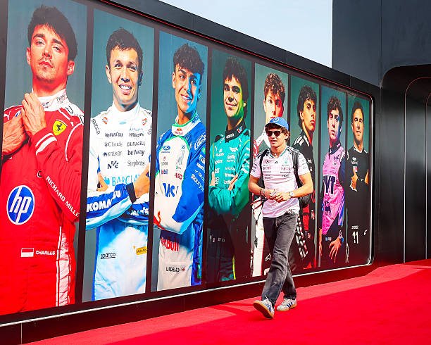 kikotonelli's tweet photo. kimi has arrived at the paddock for media day today! 🇲🇾🤍 https://t.co/CNcaG9vpa4
