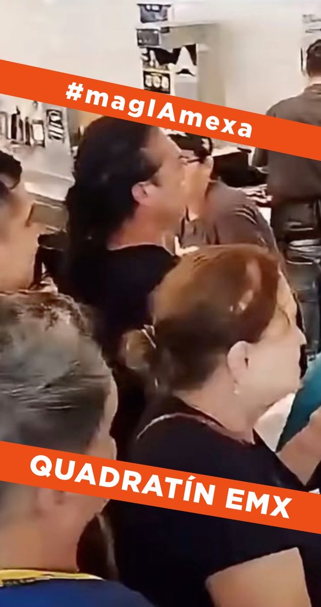 A low-quality video still or screenshot showing people in what appears to be a classroom or meeting setting, overlaid with orange banners reading '#magIAmexa' and 'QUADRATÍN EMX'.