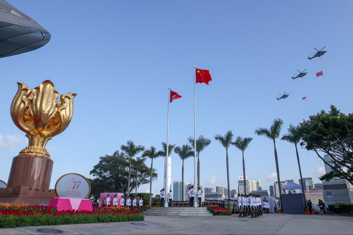 hkpoliceforce's tweet photo. The flag-raising ceremony marking the 77th Anniversary of the Founding of the People's Republic of China was held at 8am today at Golden Bauhinia Square, outside the Hong Kong Convention and Exhibition Centre.
 
The Guard of Honour marched with pride, solemnly raising the National Flag and the Regional Flag as the national anthem played.

May our country and Hong Kong enjoy enduring prosperity, peace and stability!
 
#NationalDay #FlagRaisingCeremony #HongKongPolice