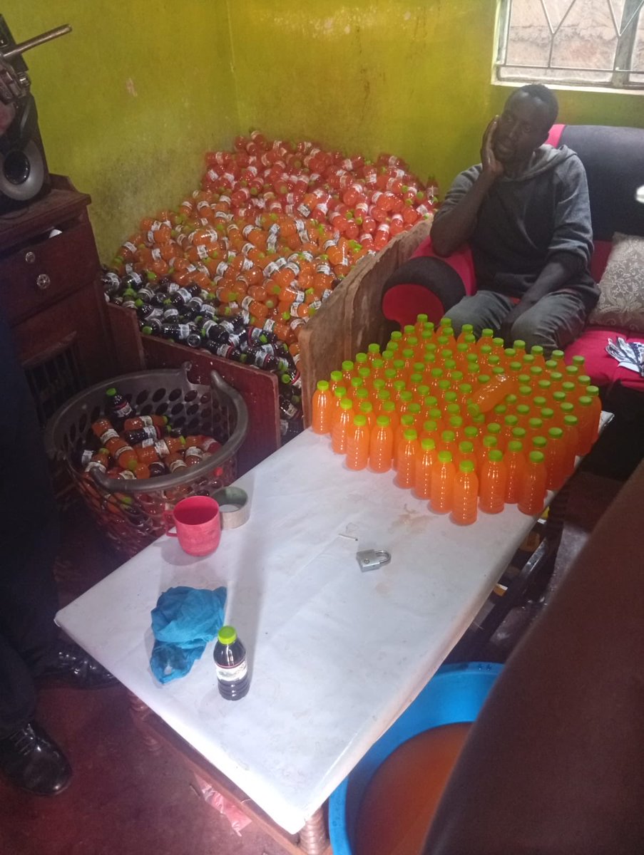 DCI_Kenya's tweet photo. 𝗖𝗢𝗨𝗡𝗧𝗘𝗥𝗙𝗘𝗜𝗧 𝗝𝗨𝗜𝗖𝗘 𝗙𝗔𝗖𝗧𝗢𝗥𝗬 𝗕𝗨𝗦𝗧𝗘𝗗 𝗜𝗡 𝗞𝗔𝗕𝗘𝗧𝗘, 𝗧𝗪𝗢 𝗦𝗨𝗦𝗣𝗘𝗖𝗧𝗦 𝗔𝗥𝗥𝗘𝗦𝗧𝗘𝗗

What looked like an ordinary homestead in Muthua, Kabete, was being used as a clandestine juice factory, until a vigilant member of the public blew the whistle.

Acting on the information, detectives from Kabete Police Station responded swiftly. At the homestead, they found two men, Alex Mwaruta and James Munala Inyangala in the middle of producing counterfeit juice. Both were arrested on the spot.

A search of the homestead then peeled back the layers of the operation, revealing what appeared to be a fully fledged counterfeiting setup. Detectives recovered approximately 1,400 filled 200ml and 300ml bottles of suspected counterfeit juice, alongside 56 cartons of empty bottles, five packets of bottle tops, two blue drums and three assorted-colour basins.

Also recovered were office glue, rubber stamps and ink, assorted stickers, an expired certificate authorising the use of the Standardisation Mark for a well-known juice brand, as well as assorted powdery and colourless substances packed in polythene bags in 50-gram portions and in 200ml and 300ml bottles.

The scene was subsequently processed by detectives from the Crime Scene Investigation (CSI), while the recovered items were secured as exhibits.

The two suspects remain in custody as investigations continue.

Counterfeit beverages produced in unregulated and unhygienic environments can expose unsuspecting consumers to serious health risks. Such illegal operations also undermine legitimate manufacturers and deprive the government of rightful tax revenue.

The DCI remains relentless in trailing down counterfeiters and dismantling the networks behind the trade.

#FichuaKwaDCI. Call 0800 722 203 (toll-free) or WhatsApp 0709 570 000 to report anonymously. Usiogope!