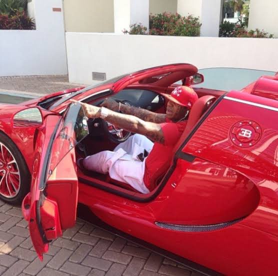 Sound_Scrape's tweet photo. Birdman with his Red Bugatti Veyron (2014) https://t.co/vGZgn29fqV