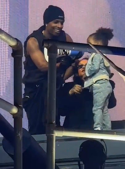 bekeestitches's tweet photo. Rihanna showed up to support A$AP Rocky, but somehow their 3-year-old son Riot ended up stealing the moment. ❤️

Rocky was performing in Copenhagen when Rihanna came onstage holding Riot, giving fans a rare glimpse of the family together.

Then Rocky handed Riot the megaphone, and the little boy addressed the crowd before sharing a sweet fist bump with his dad.

For a family that usually keeps their children away from the spotlight, seeing all three of them together like this was genuinely special. ❤️