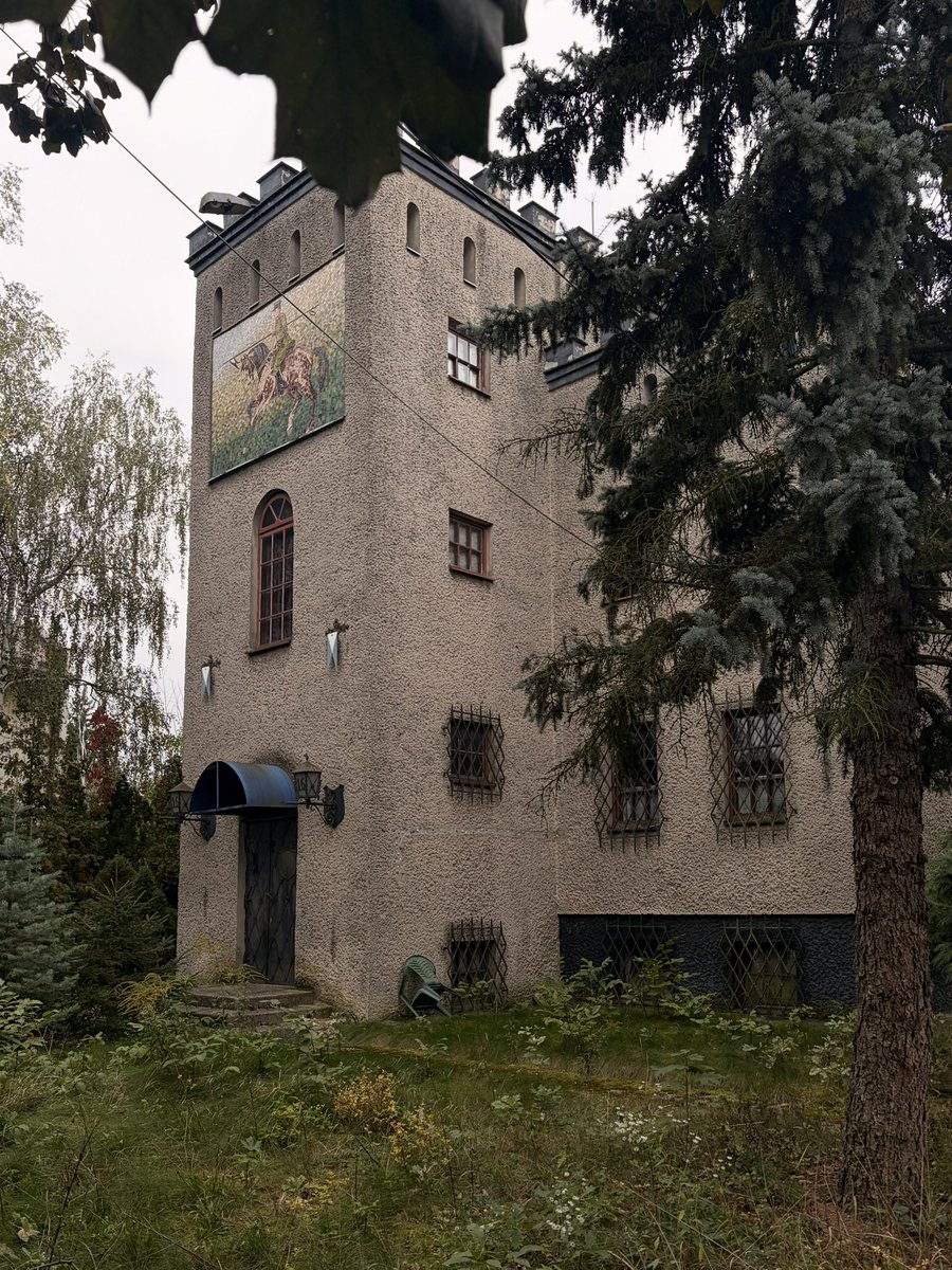 luxarbo's tweet photo. my polish grandfather’s derelict nineteen-eighties mock castle with a mosaic of him on horseback on the tower https://t.co/pryfnQ90ls